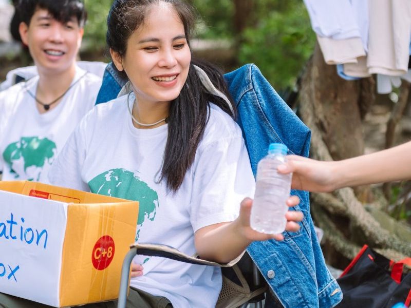 group-of-asian-diverse-people-volunteer-holding-a-donation-box-for-fundraiser-to-emergency-situation-q50w3fq39mh4teh1z25gd59biepc54x38vyphi18hs